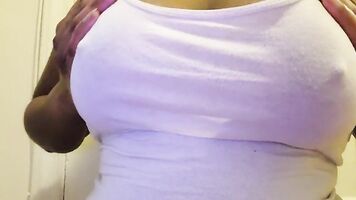 Ebony babe plays with oily tits, shows off big brown areolas