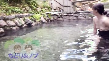 An amateur woman taking a bath while being seen by a man in a mixed bathing hot spring.