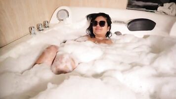 Busty Latina mischief in the hot tub